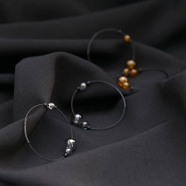 ECLIPSE HOOP EARRINGS - GREY/AMBER